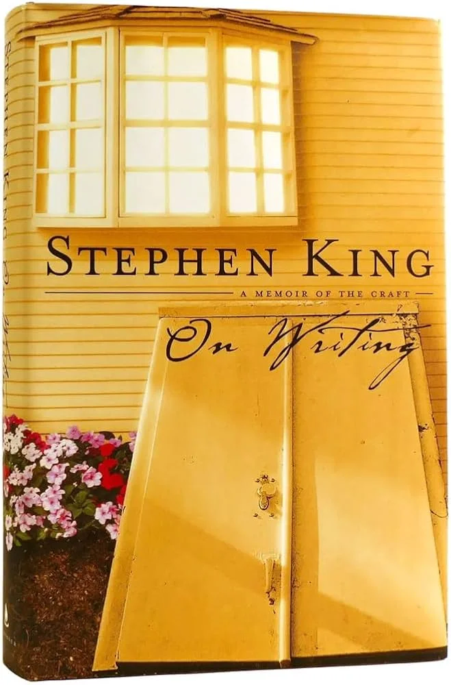Book cover of Stephen King’s On Writing: A Memoir of the Craft, showing a yellow house exterior and cellar-style doors on the front cover.