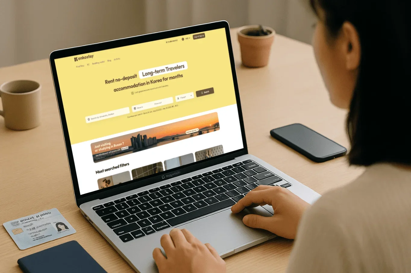 Person browsing Enkostay no-deposit housing listings