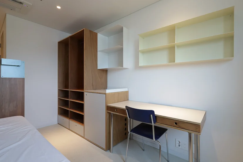 Private furnished room with a desk at Mangrove Seoul — short-term base for digital nomads.