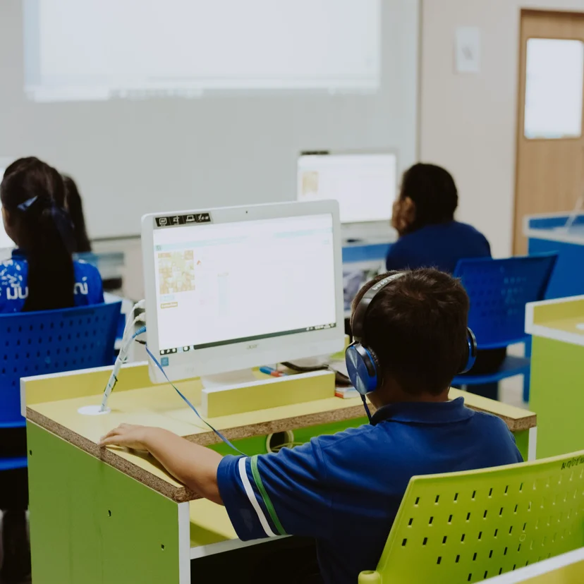 Students study by exploring lessons through digital platforms and collaborative tools.