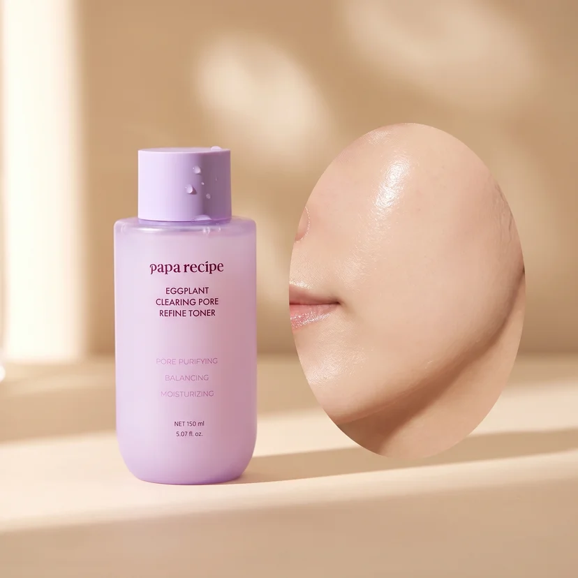 Papa Recipe pore refine milky toner bottle beside a clean, smooth-skinned face in profile with warm neutral lighting.