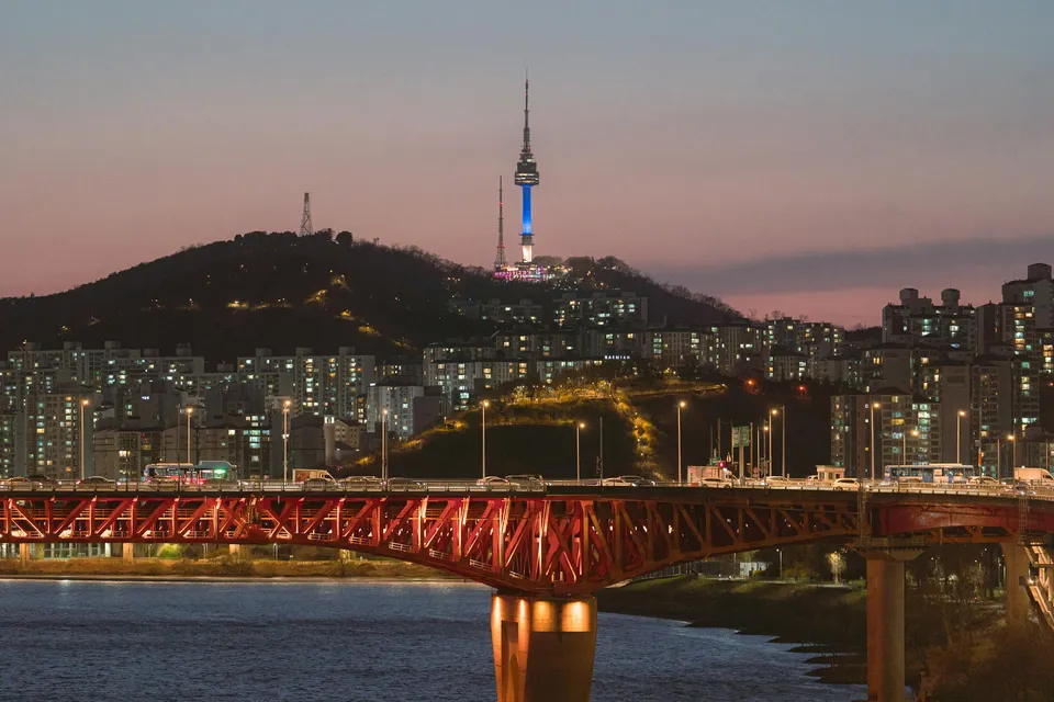 Seoul skyline at nightfall with N Seoul Tower and the Han River