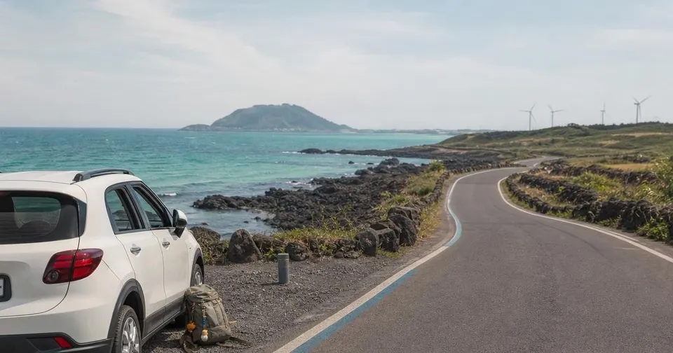 Photorealistic Jeju coastal road with ocean, volcanic stone, and a compact travel car for a slow route itinerary
