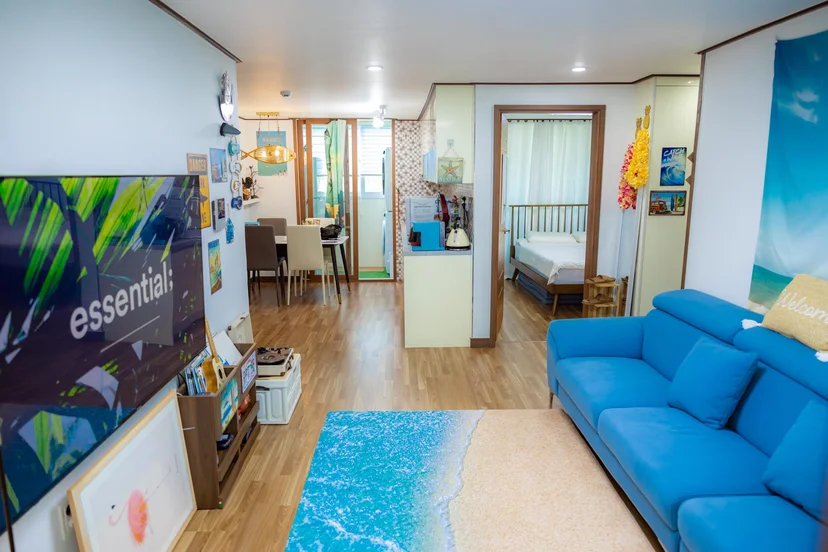 Open-plan living and dining area with a bedroom visible through the doorway (Listing ID : 4764)