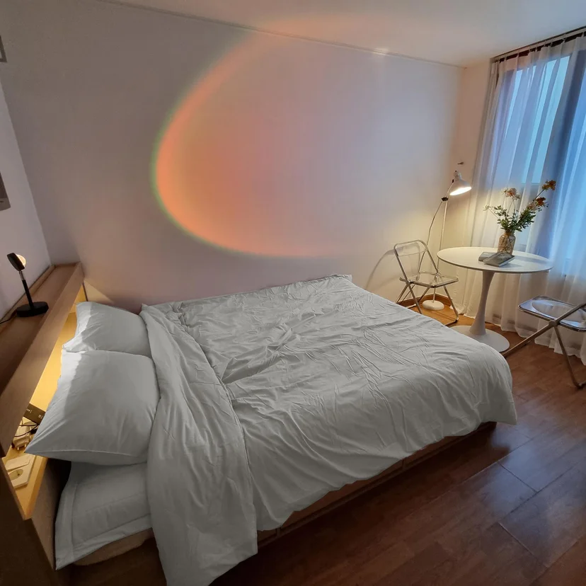 Double bed with a warm ambient lamp glow at night (Listing ID : 15851)