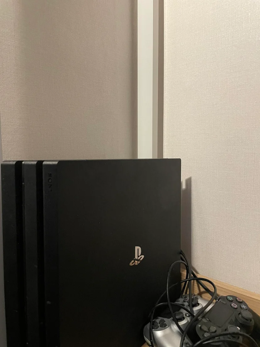 PlayStation 4 Pro with two controllers set up by the TV (Listing ID : 22604)