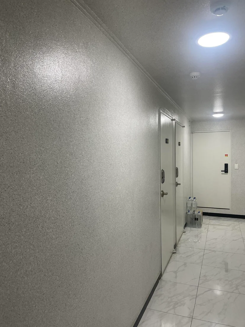 Apartment corridor with a keypad-lock front door (Listing ID : 22604)