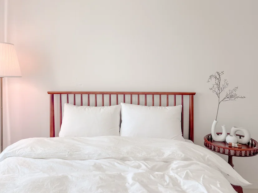 Bedroom headboard with a wood frame and white bedding (Listing ID : 34458)