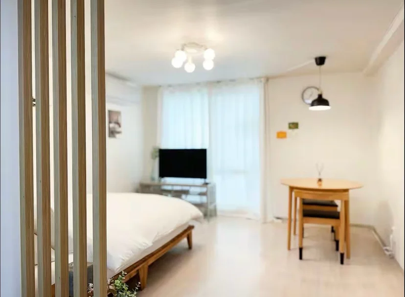 Loft level looking down over the living area and the curtained window (Listing ID : 33170)