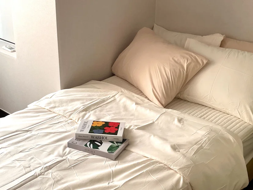 Bed with soft hotel-style bedding beside the window (Listing ID : 33622)