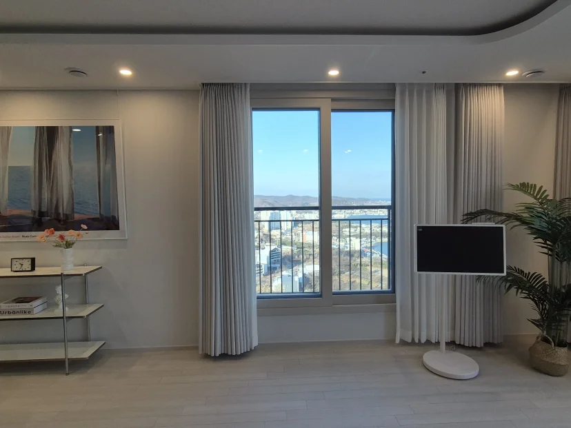 Living room window framing the harbour town (Listing ID : 46438)