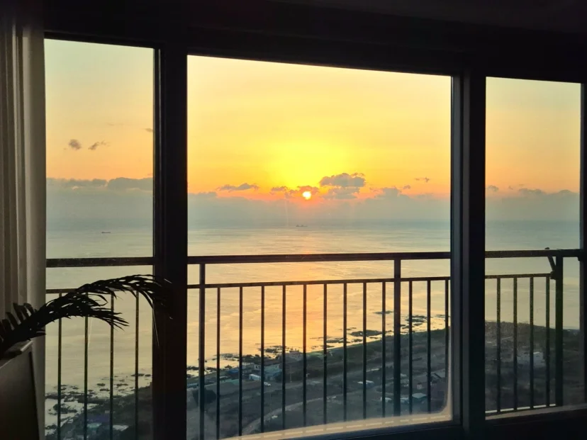 Ocean-view window with sunset over the coastline (Listing ID : 46438)