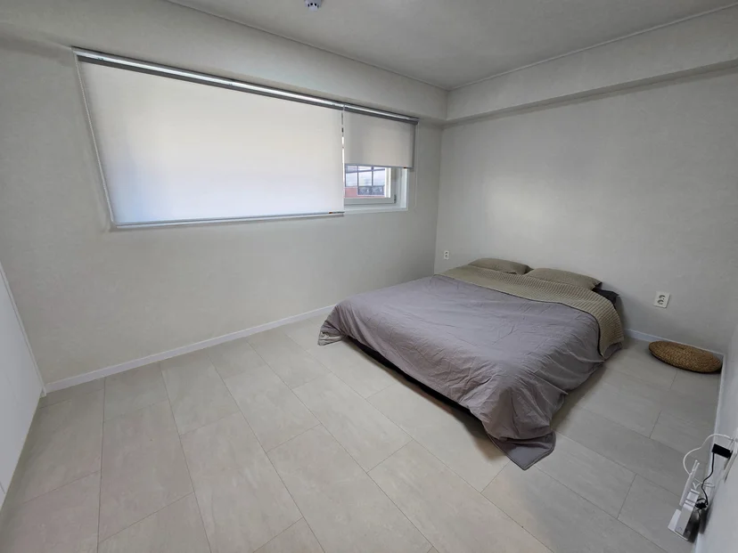 Second bedroom with a low bed and large window (Listing ID : 32497)