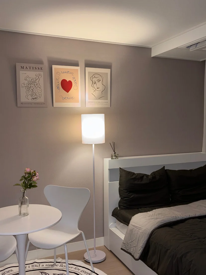 Quiet bedroom corner with small table, chair, and wall art (Listing ID : 30036)
