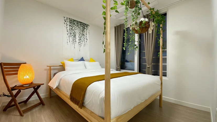 Wood-toned bedroom with a double bed (Listing ID : 40239)
