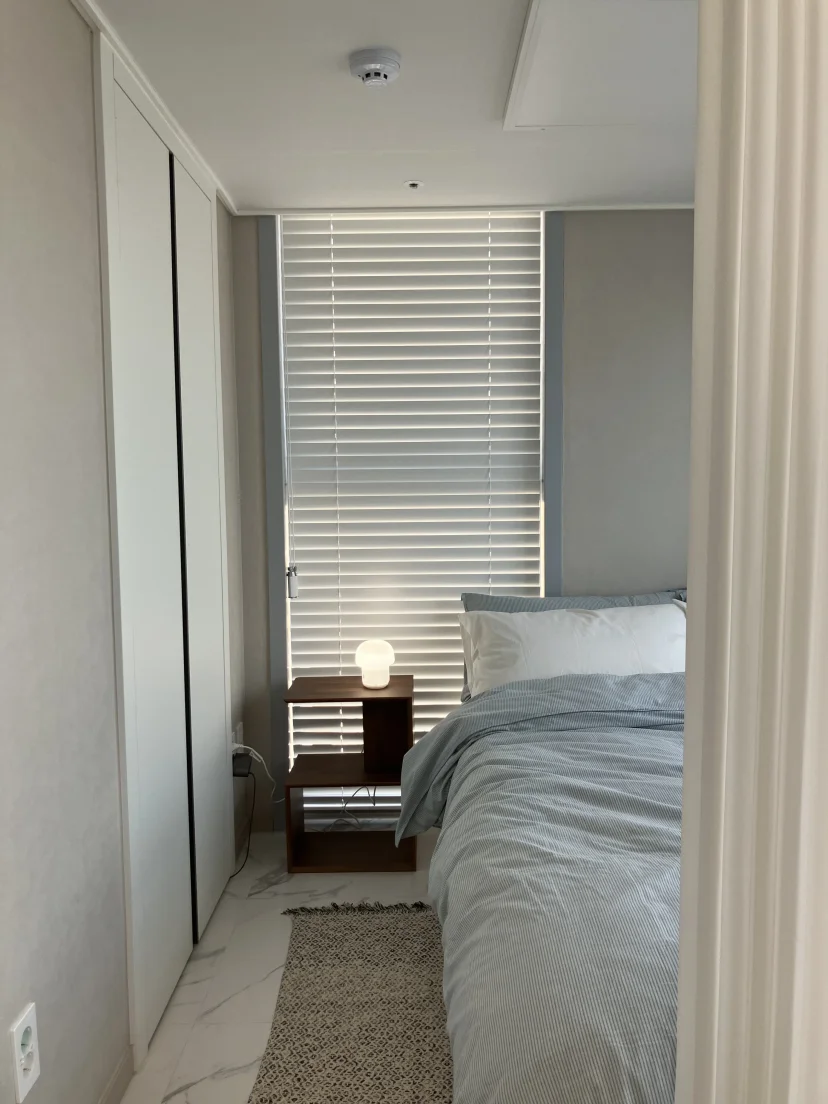 Bedroom with a double bed, walnut nightstand and built-in wardrobe (Listing ID : 25414)