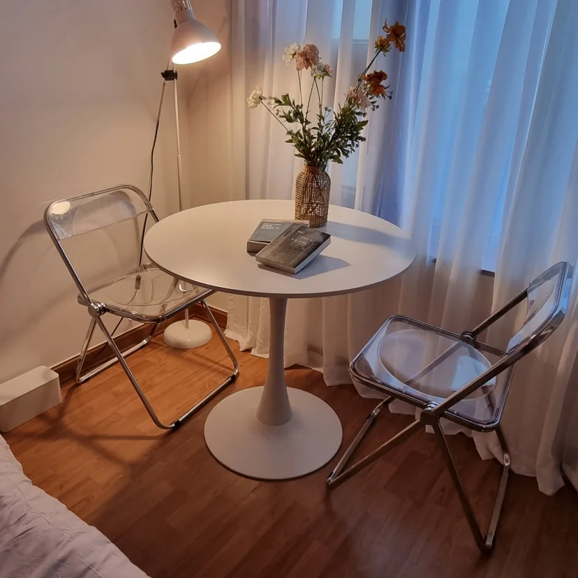 Round dining table with clear acrylic chairs by a sheer-curtained window (Listing ID : 15851)