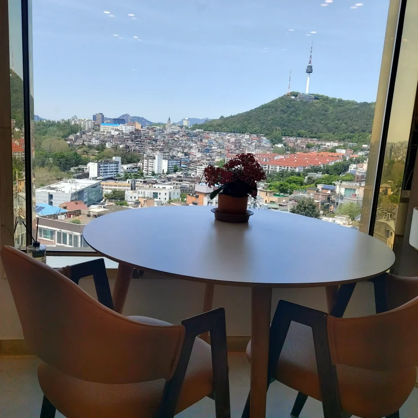 Round dining table by window with N Seoul Tower Namsan view (Listing ID : 43593)