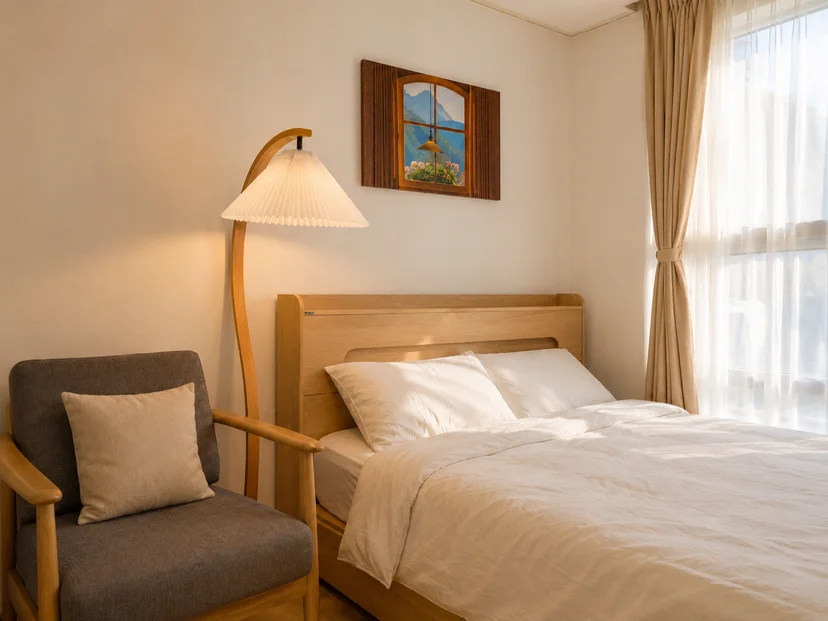 Bed with a wooden headboard, armchair and a bright window (Listing ID : 47791)