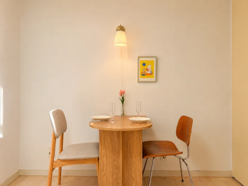 Round dining table set for two under a pendant lamp (Listing ID : 47791)