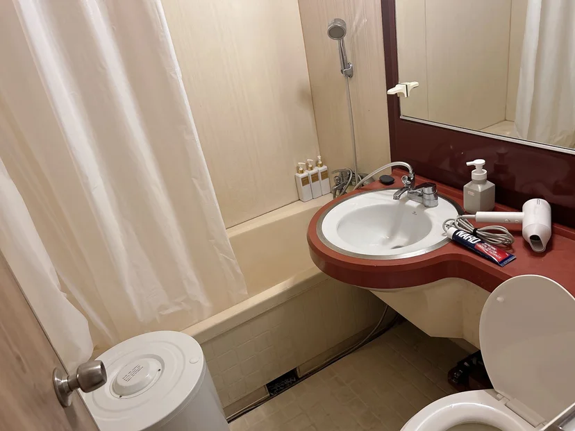Bathroom with a bathtub, curved sink vanity, and shower (Listing ID : 12332)