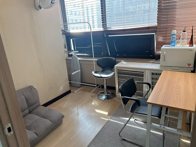 Corner desk with chairs and a small sofa by the window (Listing ID : 12332)