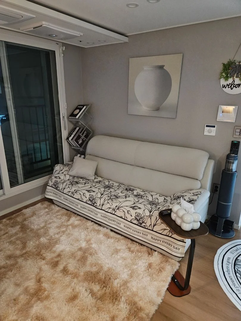Living area with a sofa and balcony door (Listing ID : 30308)