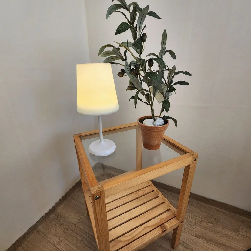 Wooden side table with a soft lamp and a potted olive plant (Listing ID : 25853)