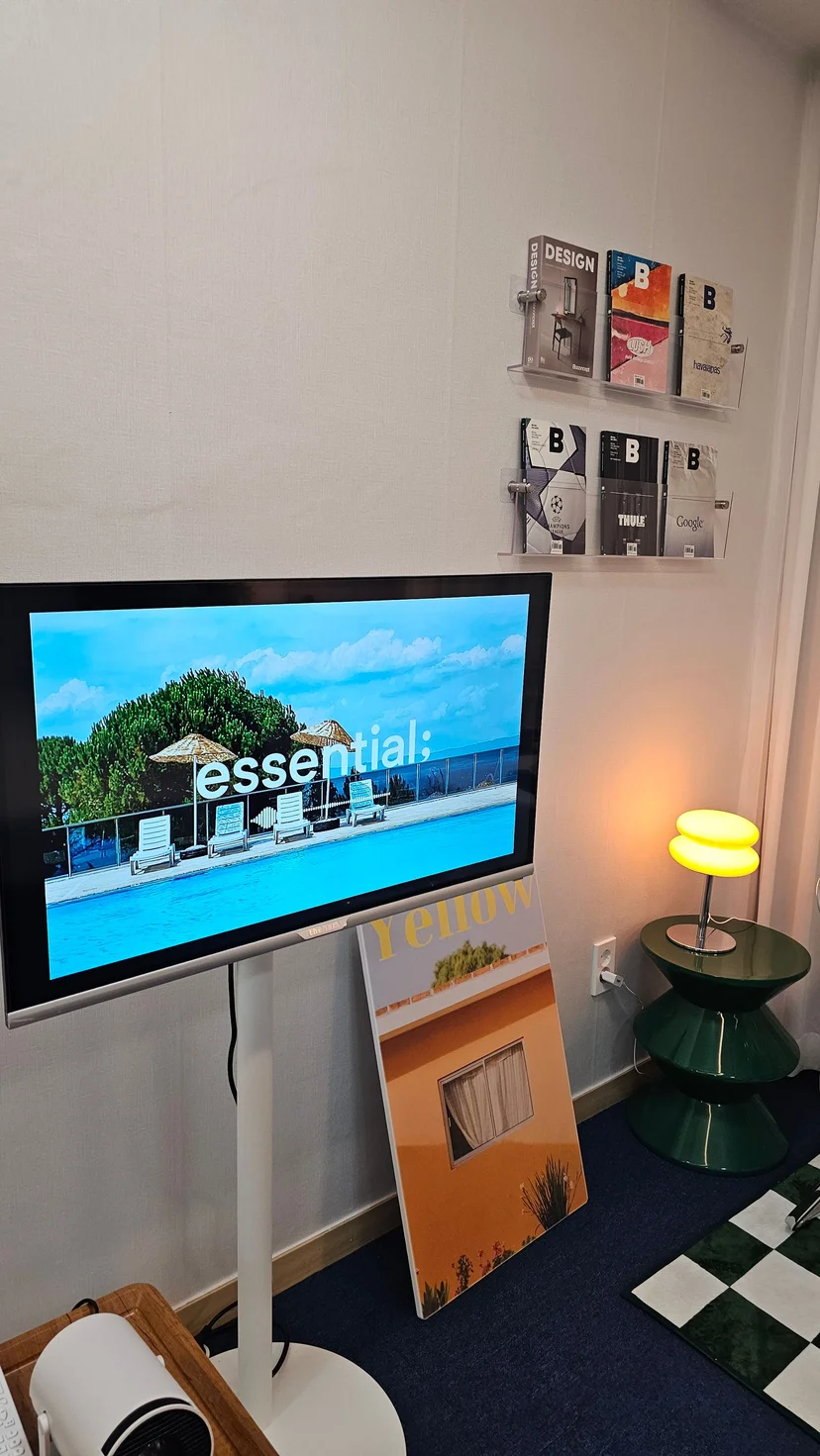 TV and design magazine display in a cozy lounge corner of a furnished officetel (Listing ID : 28024)