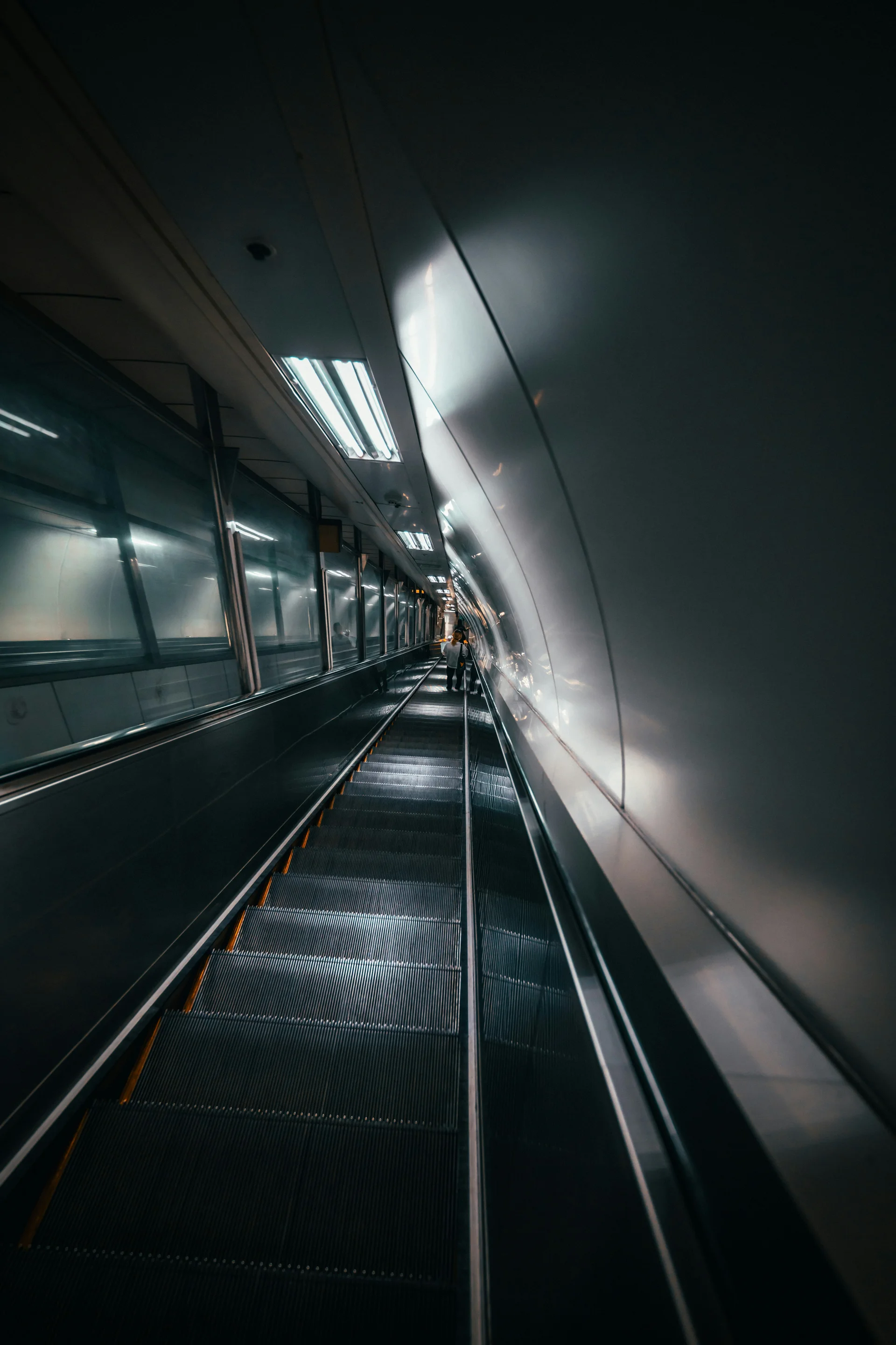 Escalator inside a Seoul subway station at night, showing the modern infrastructure of the Korean metro system